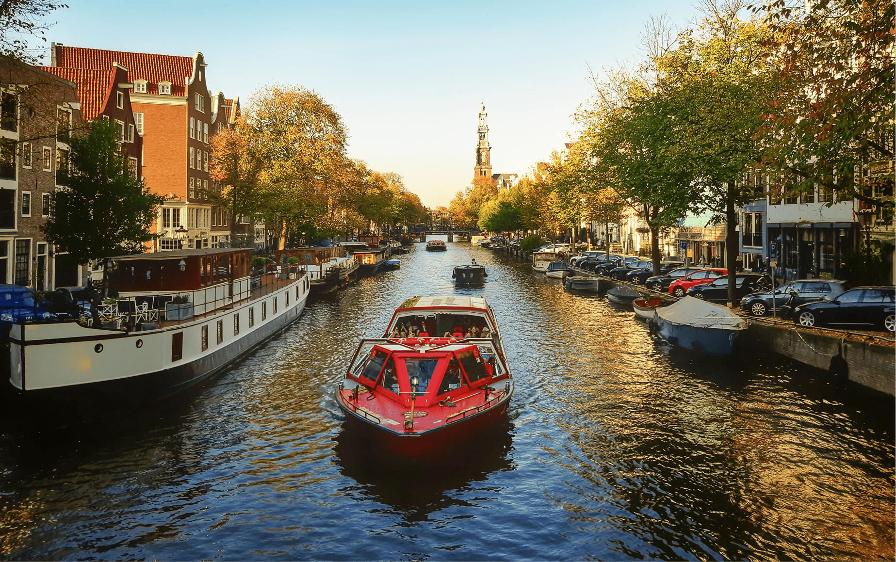 autumn-amsterdam-view-tree-lined-canal-with-boats-sunny-day 1-min