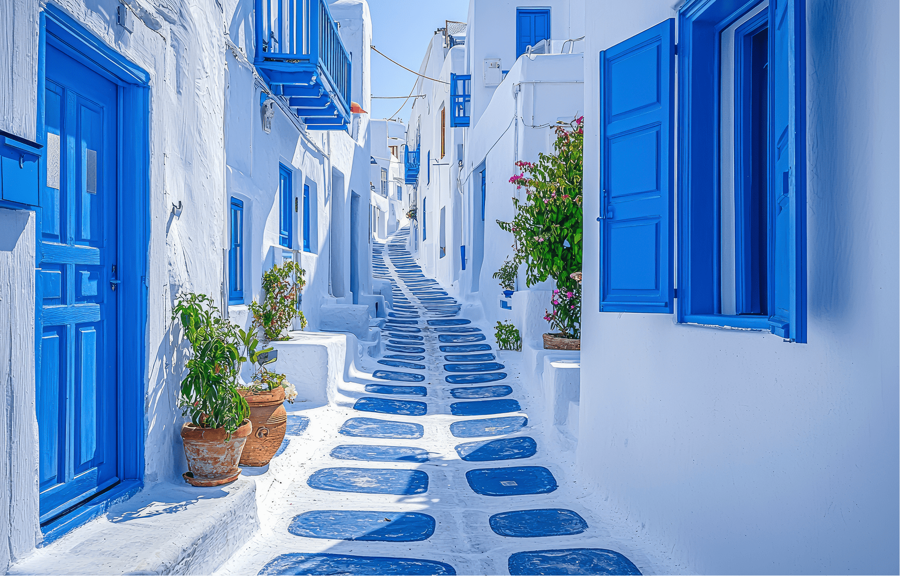 charming-greek-village-scene-quaint-blue-white-cobblestone-streets-with-traditional-houses-mykonos-island-greece-min